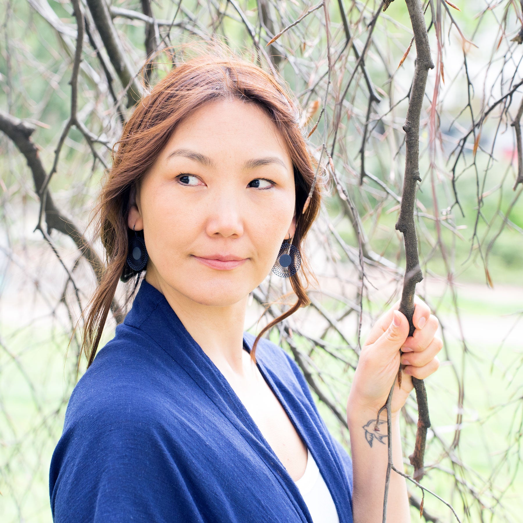 Runde Ohrringe Sonnensymbol blau